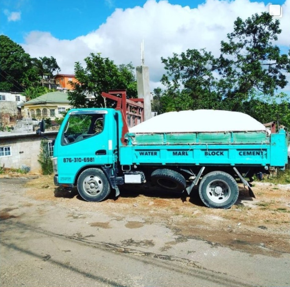 Dump truck hauling construction materials